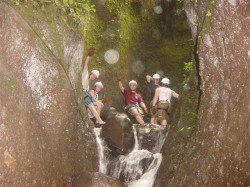 Enjoying rappelling into a canyon at San Lorenzo